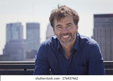 Portrait Of A Mature Active Man Smiling In A City