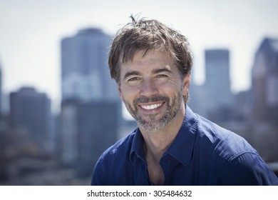 Portrait Of A Mature Active Man Smiling In A City