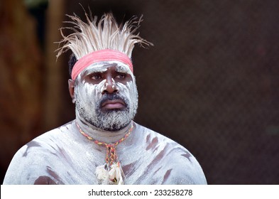 Portrait Of Mature Adult Australian Aboriginal Man With Body Paint From The Tropical Far North Of Queensland, Australia.Looking Away From The Camera. Real People. Copy Space