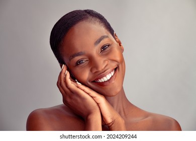 Portrait Of Mature African Woman Feeling Fresh After Spa Treatment. Happy Black Mid Adult Woman With Flawless Skin Smiling And Looking At Camera. Portrait Of Beauty Lady Isolated On Grey Background.