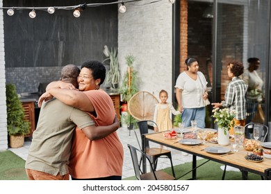 Portrait Of Mature African-American Woman Embracing Friend During Family Gathering At Dinner Party Outdoors, Copy Space