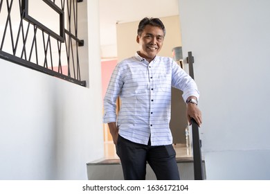 portrait of mature asian successful businessman smiling
