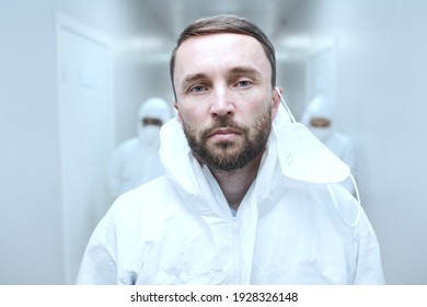 Portrait Of Mature Bearded Doctor In Uniform Looking At Camera While Working In The Clinic