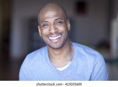 Portrait Of A Mature Black Man Smiling At Home