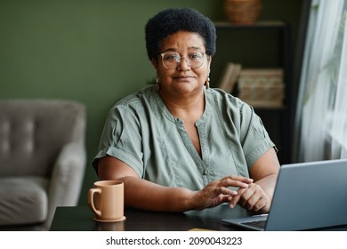 Portrait Of Mature Black Woman Using Laptop While Working From Home Or Shopping Online, Copy Space