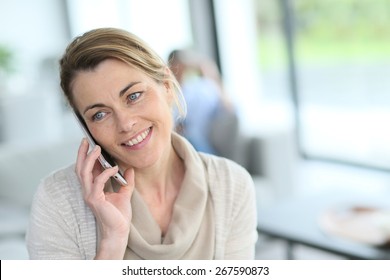 Portrait Of Mature Blond Woman Talking On Phone