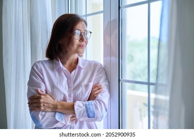 Portrait Of A Mature Confident Woman Looking Out The Window