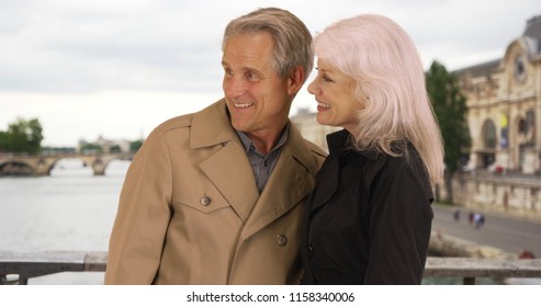 Portrait Of Mature Couple Enjoying Retirement In Paris