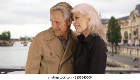 Portrait Of Mature Couple Enjoying Retirement In Paris