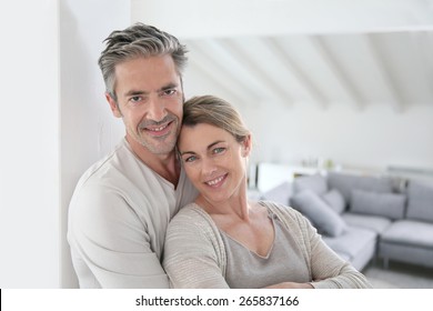 Portrait of mature couple relaxing at home