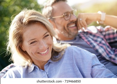 Portrait of mature couple relaxing in outdoor sofa - Shutterstock ID 719466850