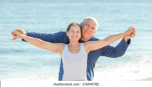 Portrait Of Mature Couple At Sea Beach