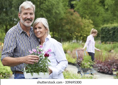 Portrait Of Mature Couple Shopping At Garden Center - Powered by Shutterstock