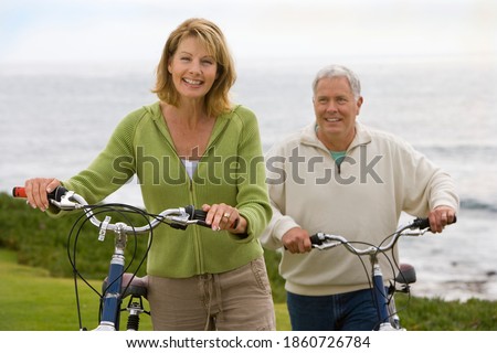 Similar – Image, Stock Photo pair of female beach slippers and a pink towel