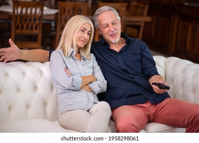 Portrait Of A Mature Couple Watching Television