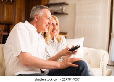 Portrait Of A Mature Couple Watching Television