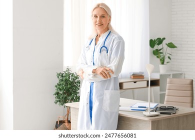 Portrait of mature female doctor in clinic - Powered by Shutterstock