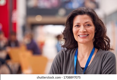 Portrait Of Mature Female Teacher Or Student In College Hall