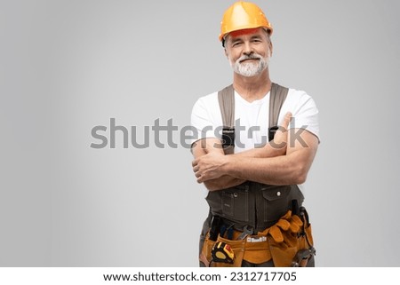 portrait of mature happy handyman isolated on white background