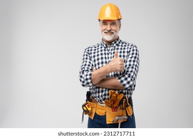 portrait of mature happy handyman showing thumb up, isolated on white background - Powered by Shutterstock