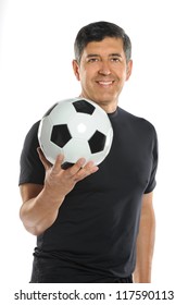 Portrait Of Mature Hispanic Man Holding Soccer Ball Isolated Over White Background