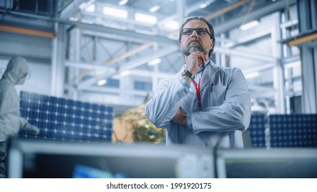 Portrait Of Mature Male Engineer Confident And Focused Thinking, Working At Aerospace Satellite Manufacturing Facility. Top World Scientists Doing Science And Technology Research In Space Program