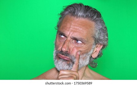 Portrait Of Mature Man Assuming The Thinker Pose