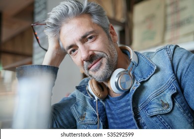 Portrait Of Mature Man With Grey Hair And Eyeglasses 