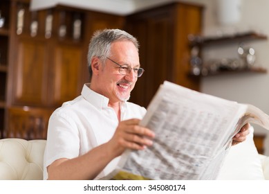 Portrait Of A Mature Man Reading A Newspaper