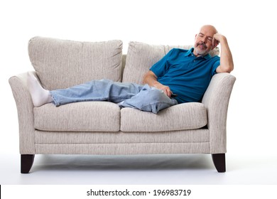 Portrait Of Mature Man Sleeping  On The Couch Isolated On White