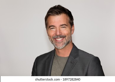  Portrait Of A Mature Man Smiling At The Camera. Isolated On White. Business.