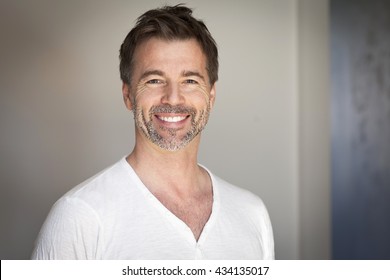 Portrait Of A Mature Man Smiling At The Camera