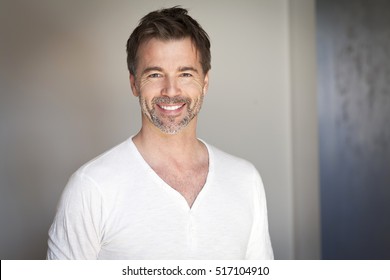 Portrait Of A Mature Man Smiling At The Camera