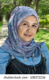 Portrait Of Mature Muslim Woman On Nature Background