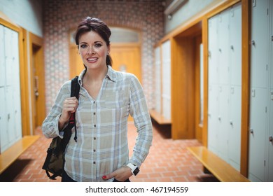 Portrait of mature student standing in the locker room at college - Powered by Shutterstock