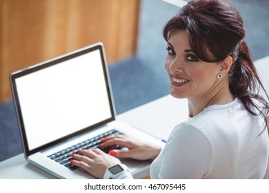 Portrait Of Mature Student Using Laptop In The Classroom