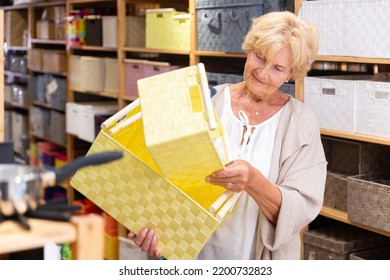 Portrait Of Mature Woman Buying Storage Basket In A Household Goods Store