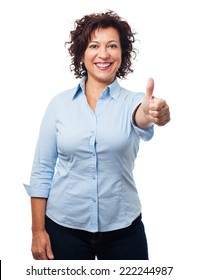 portrait of a mature woman doing a positive gesture on a white background