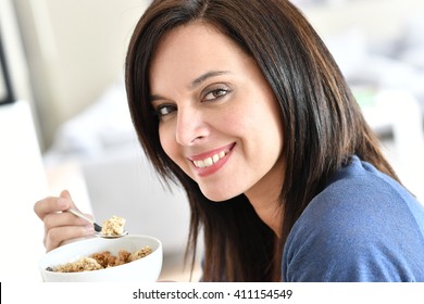 Portrait Of Mature Woman Eating Cereals