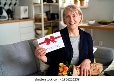 Portrait Of Mature Woman With Gift Card