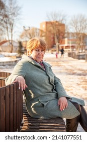  Portrait Of    Mature Woman    Sitting On Bench In Spring