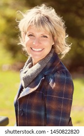 Portrait Of A Mature Woman Smiling At The Camera. She Is Really Happy
