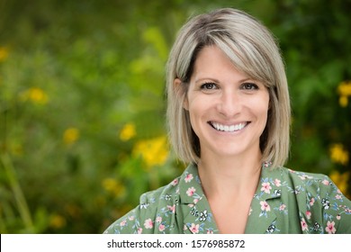 Portrait Of A Mature Woman Smiling At The Camera. She Is Really Happy