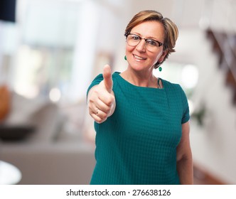 Portrait Of A Mature Woman With Thumbs Up