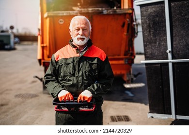 Portrait Of A Mature Worker Of The City Utility Company. Garbage Collector.