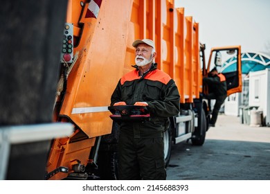 Portrait Of A Mature Worker Of The City Utility Company. Garbage Collector.