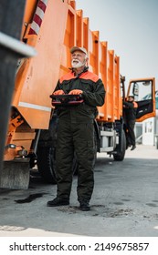 Portrait Of A Mature Worker Of The City Utility Company. Garbage Collector.