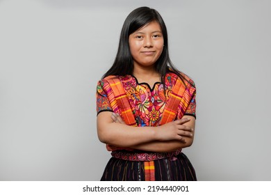 Portrait of Mayan woman with typical costume - Hispanic young woman with colorful traditional clothes on white background - Hispanic teenager - Shutterstock ID 2194440901