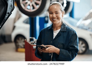 Portrait, mechanic and woman with smartphone in auto repair shop, smile and internet for online schedule. Face, inspection and person with cellphone in garage and vehicle maintenance with opportunity - Powered by Shutterstock