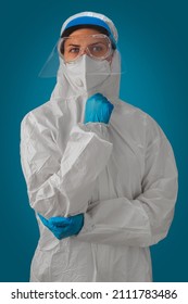 Portrait Of Medical Staff In Personal Protective Equipment Or PPE Suit, Face Shield, Safety Goggles And White N95 Mask For Protect Coronavirus Covid-19. Protection From Infectious Disease, Disease.